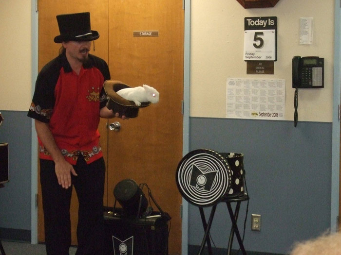 A visiting magician finds a bunny in his hat